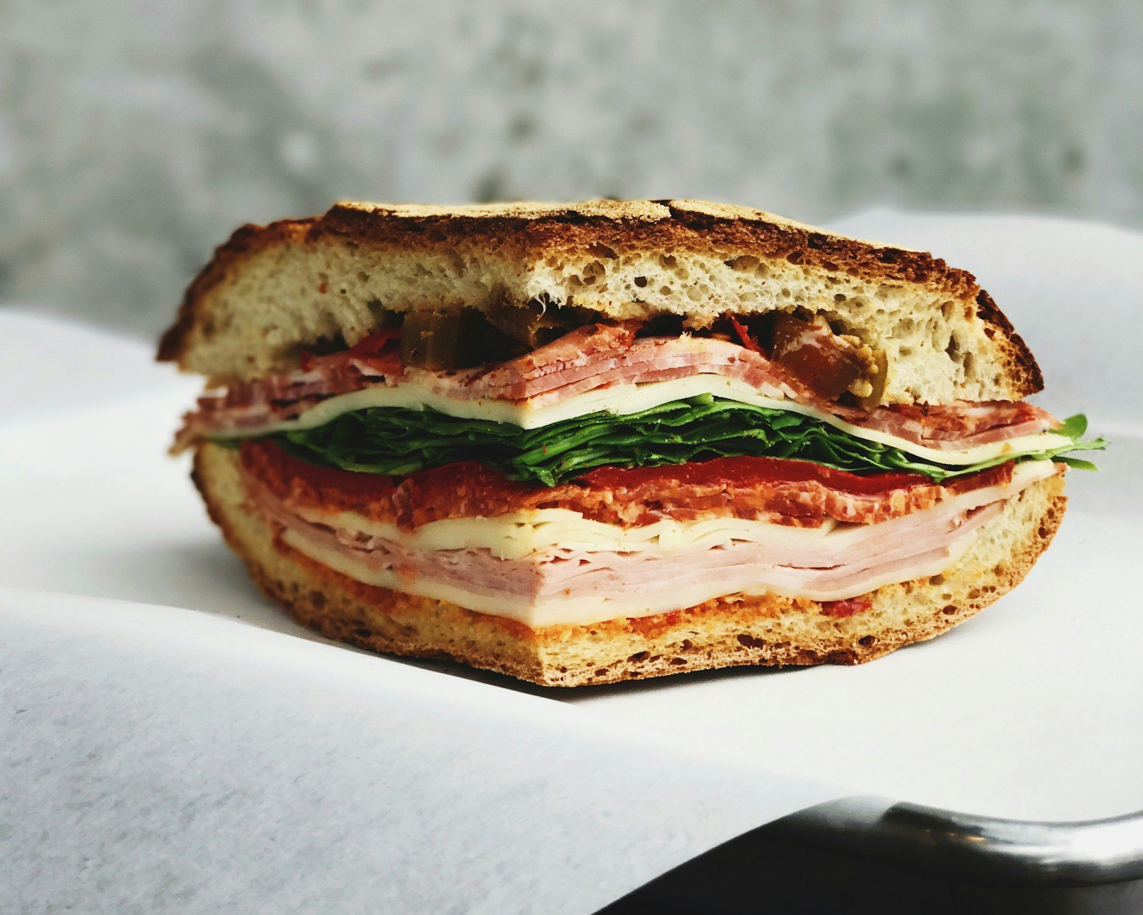 Deli sandwich with meat and greens at Dan's Grill in Blairsville, GA